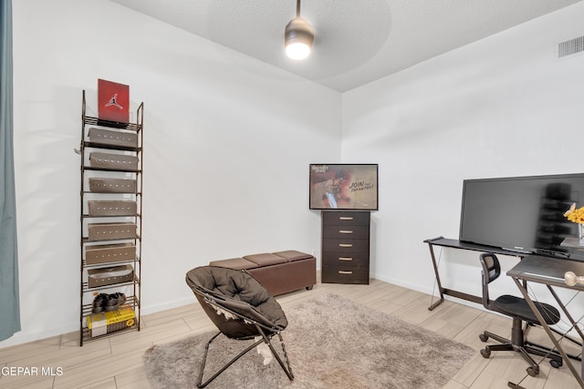 532 Gentry Way, El Paso, TX 79928 - home office featuring baseboards, wood finished floors, a ceiling fan, and a textured ceiling
