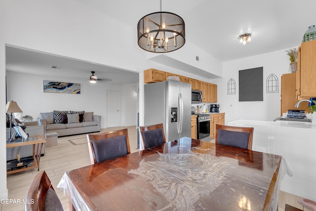 532 Gentry Way, El Paso, TX 79928 - dining space featuring a chandelier, a ceiling fan, and light wood-style floors