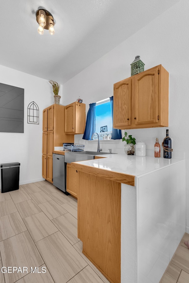 532 Gentry Way, El Paso, TX 79928 - kitchen with dishwasher, a peninsula, and light countertops
