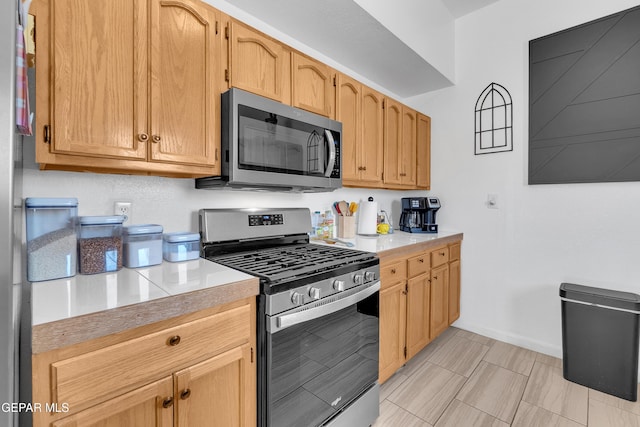 532 Gentry Way, El Paso, TX 79928 - kitchen with stainless steel appliances, light countertops, and baseboards