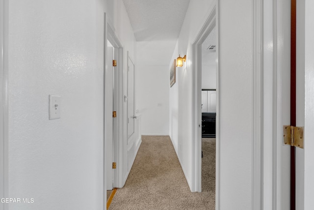 532 Gentry Way, El Paso, TX 79928 - hallway with light carpet and baseboards