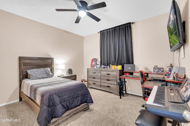 532 Gentry Way, El Paso, TX 79928 - bedroom featuring carpet flooring, an office area, ceiling fan, and a textured ceiling