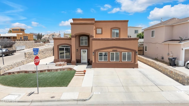 532 Gentry Way, El Paso, TX 79928 - mediterranean / spanish-style home with a residential view and stucco siding