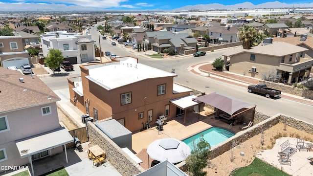 532 Gentry Way, El Paso, TX 79928 - aerial perspective of suburban area featuring a pool area and mountains