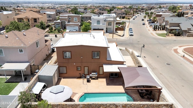 532 Gentry Way, El Paso, TX 79928 - aerial perspective of suburban area with a pool and mountains