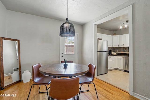 3408 Stanton St 233179, El Paso, TX 79902 - dining area with light wood finished floors