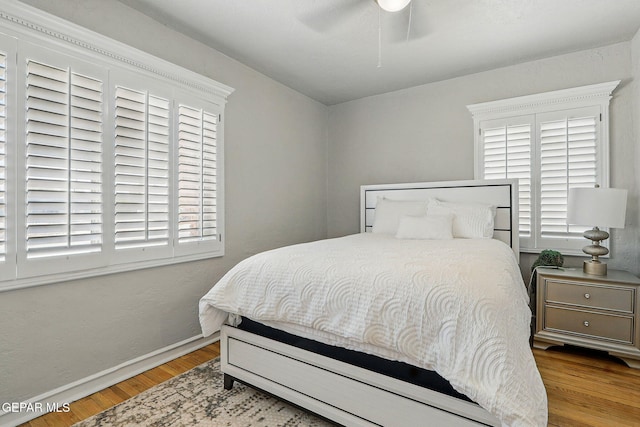 3408 Stanton St 233179, El Paso, TX 79902 - bedroom featuring wood finished floors, baseboards, and a ceiling fan