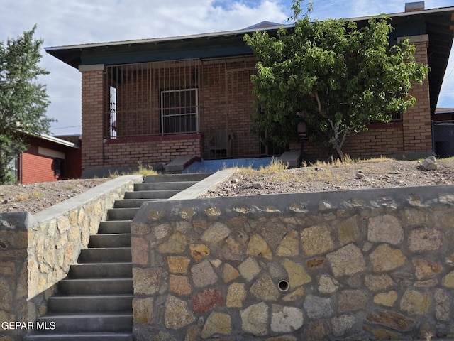 3812 Wilson Way, El Paso, TX 79903 - view of front facade with stairs and brick siding
