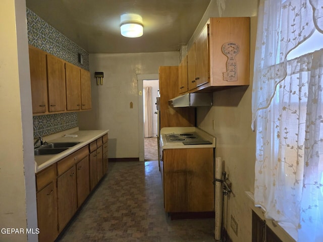 3812 Wilson Way, El Paso, TX 79903 - kitchen featuring a sink, under cabinet range hood, electric stovetop, light countertops, and tasteful backsplash