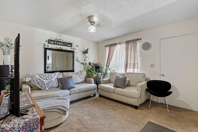 8957 Robert Dr Unit A & B, El Paso, TX 79904 - carpeted living area featuring a ceiling fan and a textured ceiling