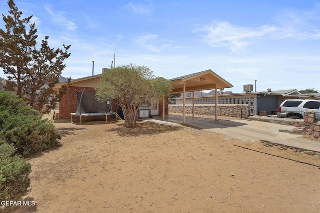 8957 Robert Dr Unit A & B, El Paso, TX 79904 - view of front of property featuring a trampoline and a carport