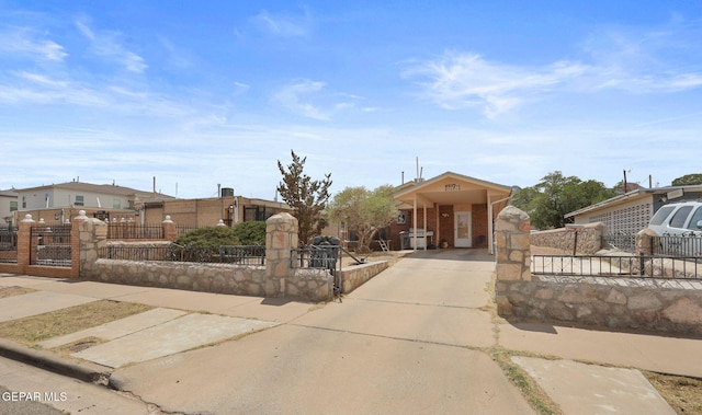 8957 Robert Dr Unit A & B, El Paso, TX 79904 - bungalow-style house featuring a gate, a fenced front yard, and driveway