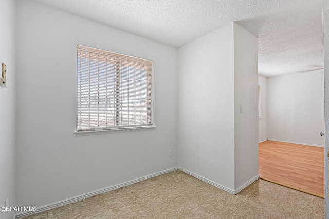 8957 Robert Dr Unit A & B, El Paso, TX 79904 - carpeted empty room with a textured ceiling and baseboards