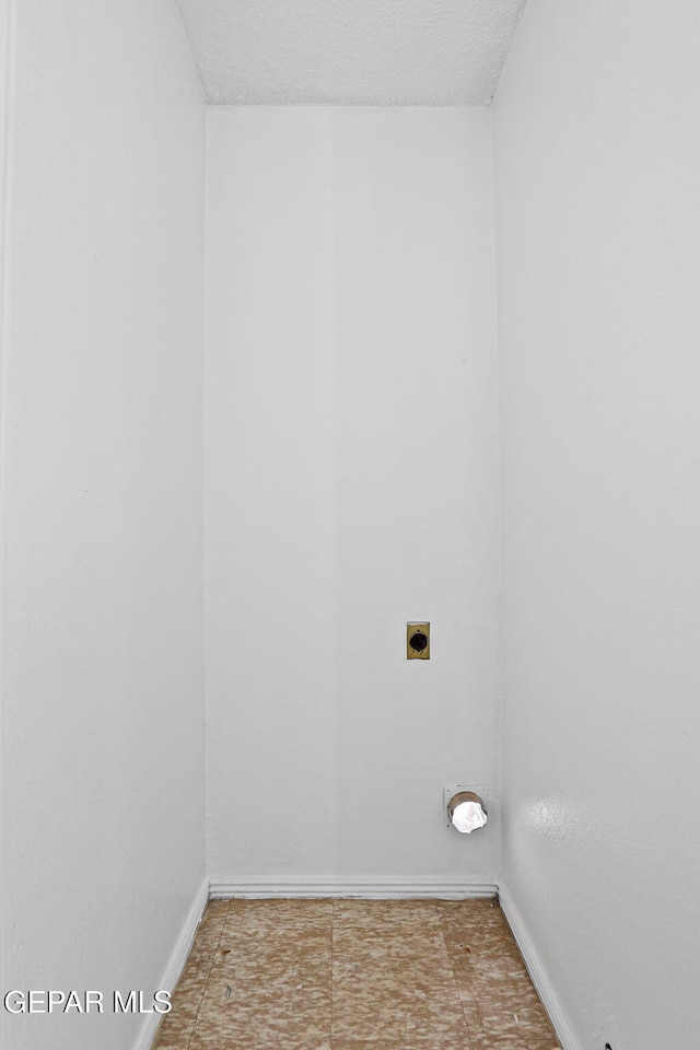 8957 Robert Dr Unit A & B, El Paso, TX 79904 - laundry room with hookup for an electric dryer and baseboards