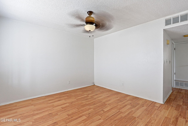 8957 Robert Dr Unit A & B, El Paso, TX 79904 - unfurnished room with light wood-type flooring, ceiling fan, a textured ceiling, and baseboards
