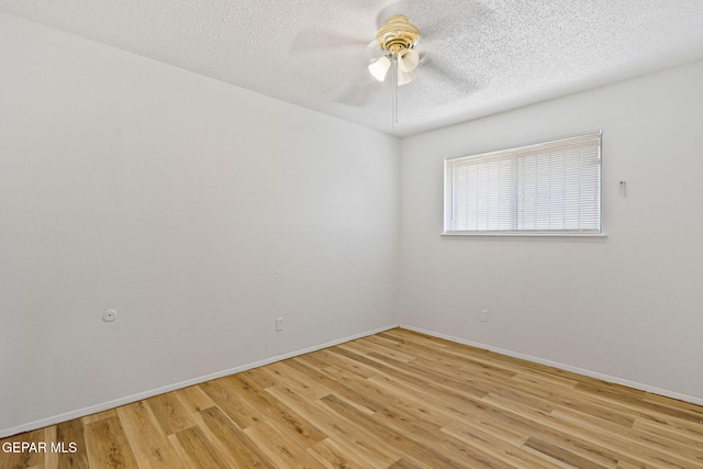 8957 Robert Dr Unit A & B, El Paso, TX 79904 - spare room with a ceiling fan, light wood-style flooring, a textured ceiling, and baseboards