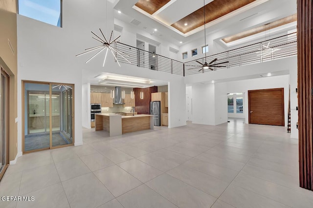 820 W Gate, El Paso, TX 79932 - unfurnished living room with a high ceiling, light tile patterned flooring, baseboards, and a ceiling fan