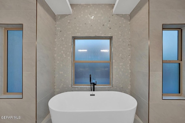 820 W Gate, El Paso, TX 79932 - bathroom featuring tile walls and a soaking tub