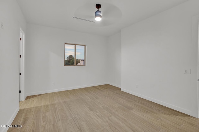 820 W Gate, El Paso, TX 79932 - empty room featuring light wood-style floors, ceiling fan, and baseboards