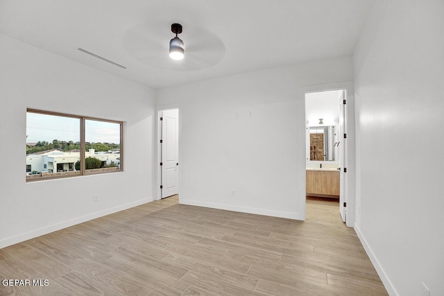 820 W Gate, El Paso, TX 79932 - unfurnished room with a ceiling fan, light wood finished floors, and baseboards