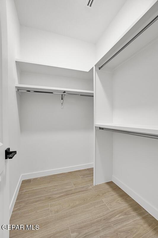 820 W Gate, El Paso, TX 79932 - walk in closet with light wood-style flooring