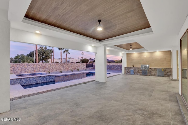 820 W Gate, El Paso, TX 79932 - patio terrace at dusk with area for grilling, a patio area, and a pool with connected hot tub