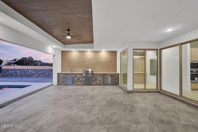 820 W Gate, El Paso, TX 79932 - patio terrace at dusk featuring a patio area, a swimming pool, and a sink