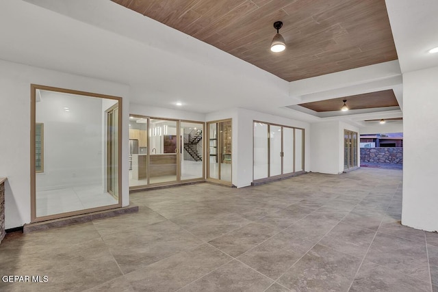 820 W Gate, El Paso, TX 79932 - tiled empty room with wood ceiling and a raised ceiling