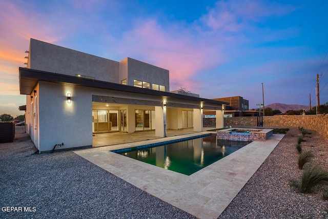 820 W Gate, El Paso, TX 79932 - back of house with a patio area, a pool with connected hot tub, and stucco siding