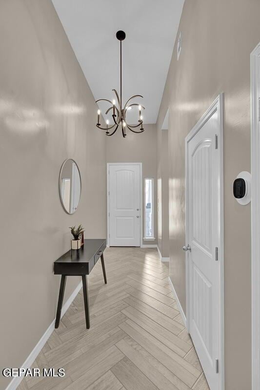 13404 Coldham St, El Paso, TX 79928 - foyer with a chandelier, baseboards, and a towering ceiling