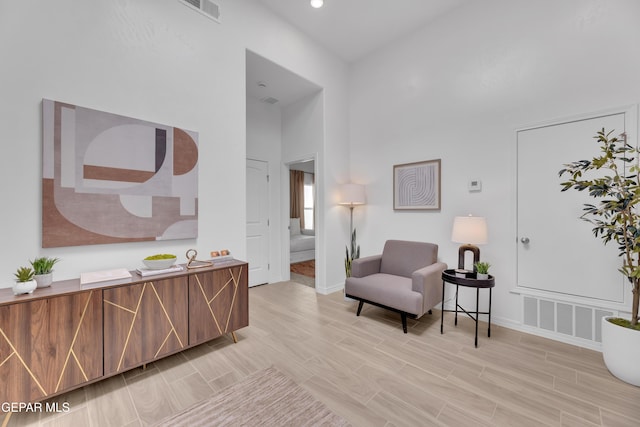 13404 Coldham St, El Paso, TX 79928 - living area featuring baseboards, light wood finished floors, a high ceiling, and recessed lighting