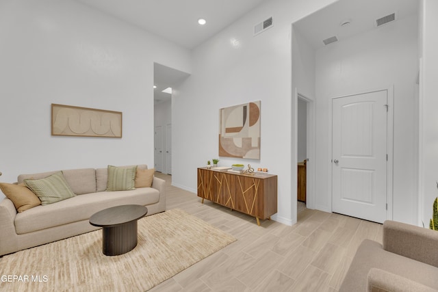 13404 Coldham St, El Paso, TX 79928 - living room with a high ceiling, baseboards, light wood finished floors, and recessed lighting