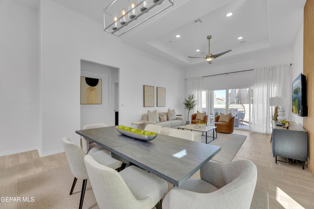 13404 Coldham St, El Paso, TX 79928 - dining space featuring a raised ceiling, light wood-style floors, recessed lighting, ceiling fan, and baseboards