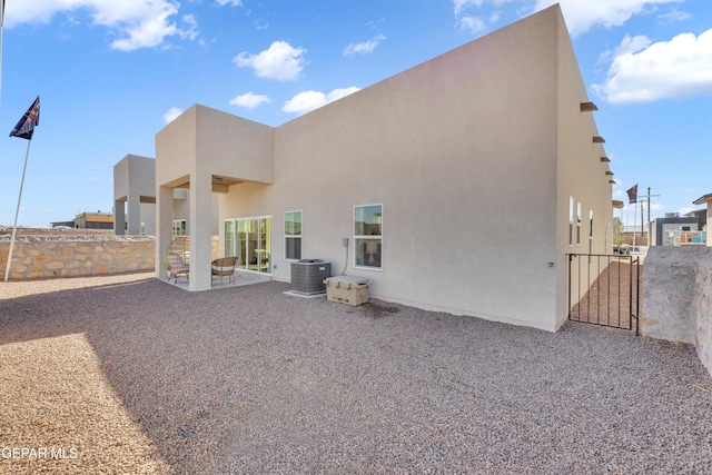 13404 Coldham St, El Paso, TX 79928 - back of house featuring stucco siding, a gate, a patio area, and cooling unit