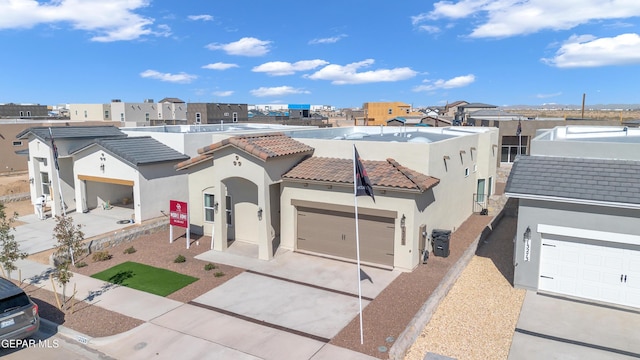 13404 Coldham St, El Paso, TX 79928 - view of front of home featuring stucco siding, a tiled roof, a garage, concrete driveway, and a residential view