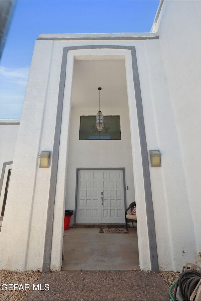 6008 Camino Alegre Dr, El Paso, TX 79912 - doorway to property with stucco siding
