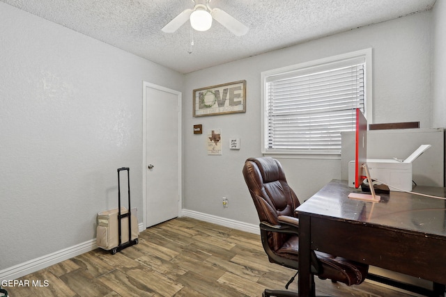6008 Camino Alegre Dr, El Paso, TX 79912 - office featuring a ceiling fan, a textured ceiling, wood finished floors, and baseboards