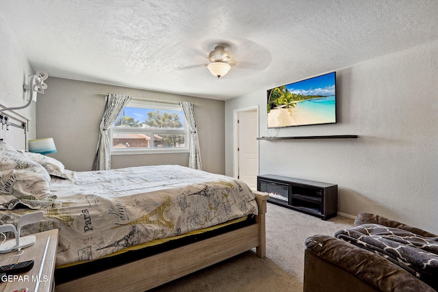 6008 Camino Alegre Dr, El Paso, TX 79912 - carpeted bedroom with a textured ceiling, a ceiling fan, and a textured wall