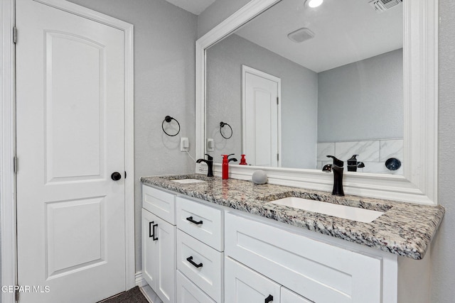 6008 Camino Alegre Dr, El Paso, TX 79912 - bathroom featuring double vanity