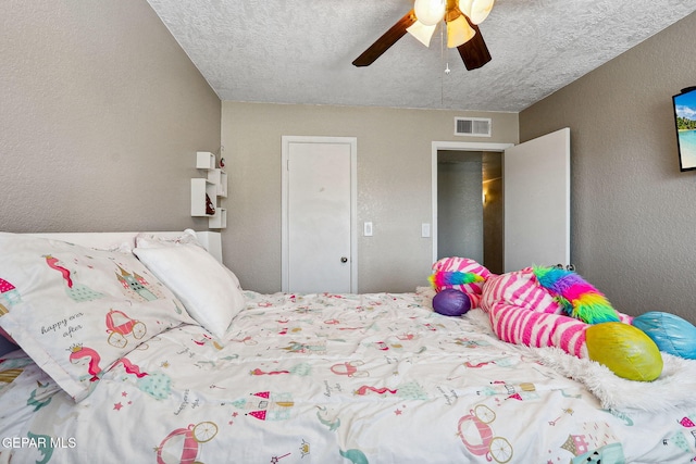 6008 Camino Alegre Dr, El Paso, TX 79912 - bedroom featuring a textured wall, a textured ceiling, and ceiling fan