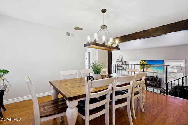 6008 Camino Alegre Dr, El Paso, TX 79912 - dining space featuring baseboards, wood finished floors, a chandelier, and beam ceiling