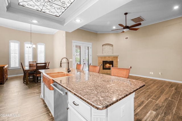 14624 Long Shadow Ave, El Paso, TX 79938 - kitchen featuring crown molding, recessed lighting, dishwasher, a fireplace, and french doors