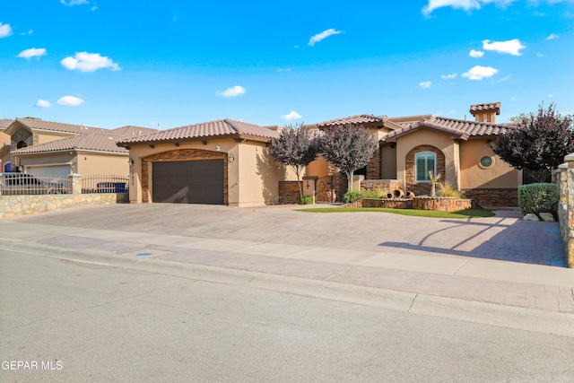 14624 Long Shadow Ave, El Paso, TX 79938 - mediterranean / spanish home featuring stucco siding, concrete driveway, a tile roof, and a garage