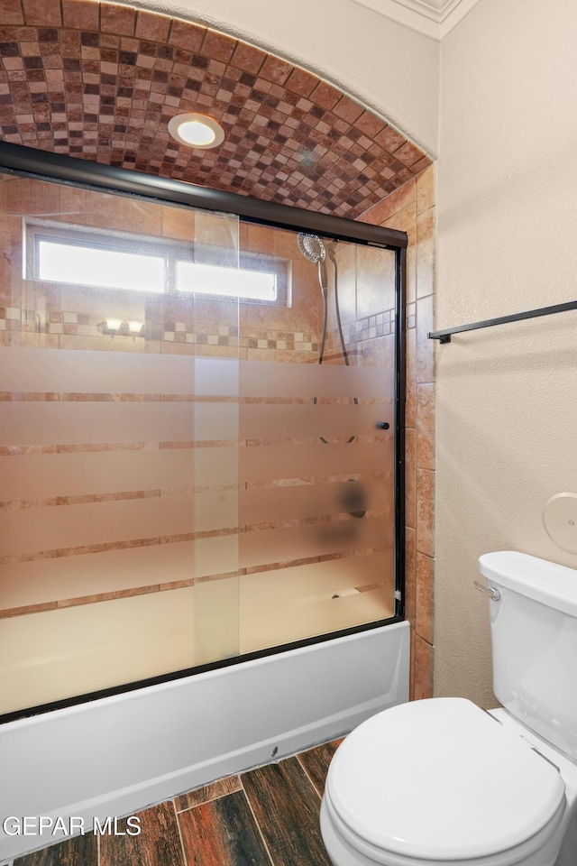 14624 Long Shadow Ave, El Paso, TX 79938 - full bathroom featuring enclosed tub / shower combo, toilet, and wood finished floors