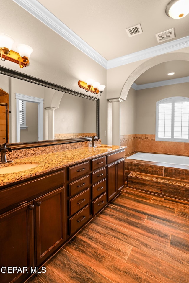 14624 Long Shadow Ave, El Paso, TX 79938 - full bathroom featuring crown molding, a garden tub, double vanity, ornate columns, and a shower with door