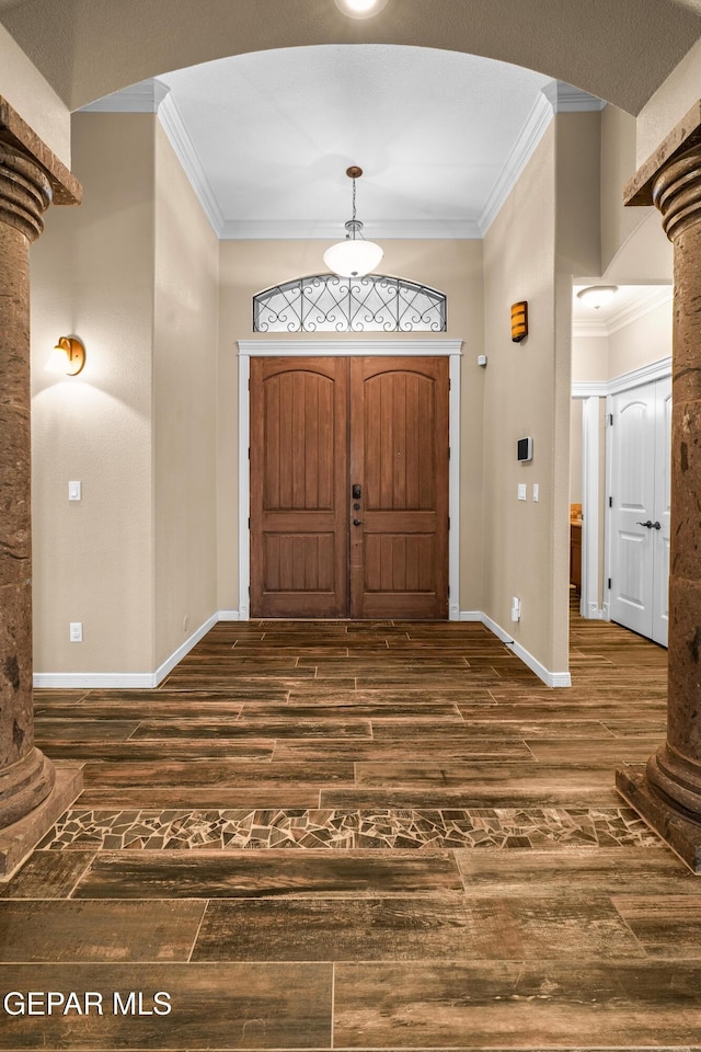 14624 Long Shadow Ave, El Paso, TX 79938 - foyer entrance featuring ornate columns, crown molding, dark wood-type flooring, and baseboards