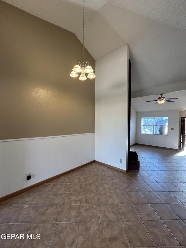 6061 Bridalveil Dr, El Paso, TX 79924 - unfurnished dining area featuring a chandelier, lofted ceiling, dark tile patterned floors, ceiling fan, and baseboards