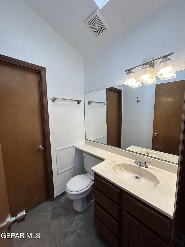 6061 Bridalveil Dr, El Paso, TX 79924 - bathroom featuring lofted ceiling, unfinished concrete floors, vanity, and toilet