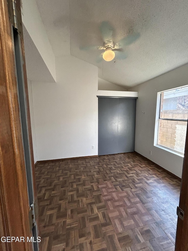 6061 Bridalveil Dr, El Paso, TX 79924 - unfurnished room with lofted ceiling, ceiling fan, a textured ceiling, and baseboards