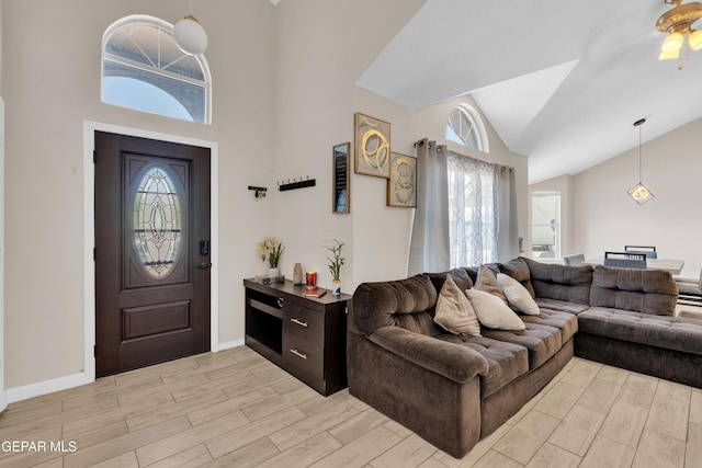 13324 Mitchell Dr, Horizon City, TX 79928 - entrance foyer featuring healthy amount of natural light, light wood-type flooring, ceiling fan, and high vaulted ceiling